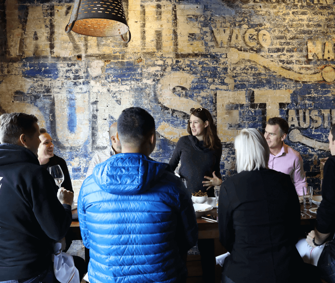 A group of people working together around a table