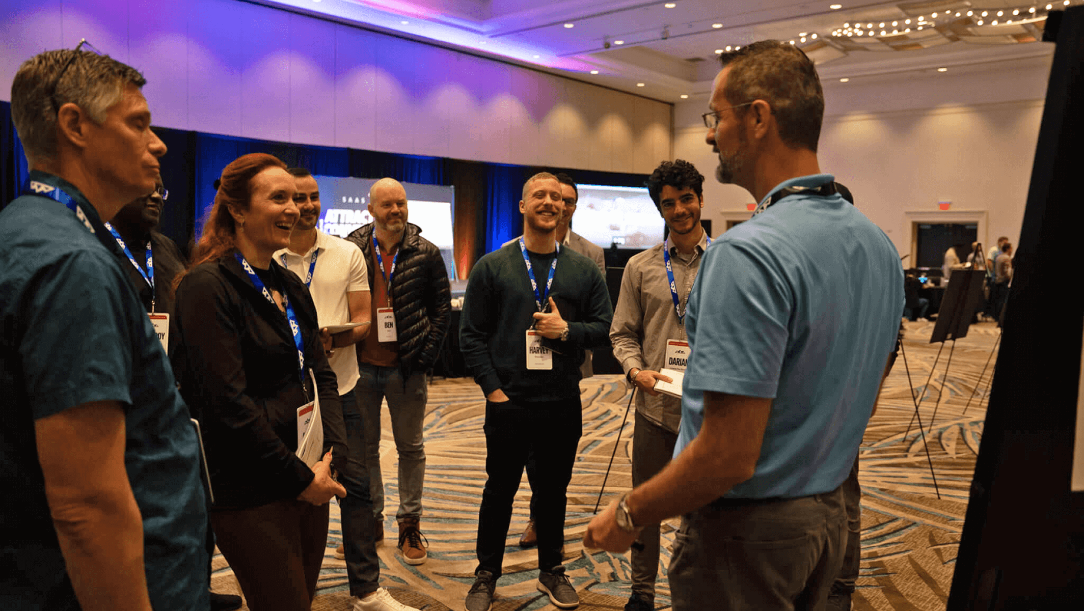 A group of conference attendees laughing together