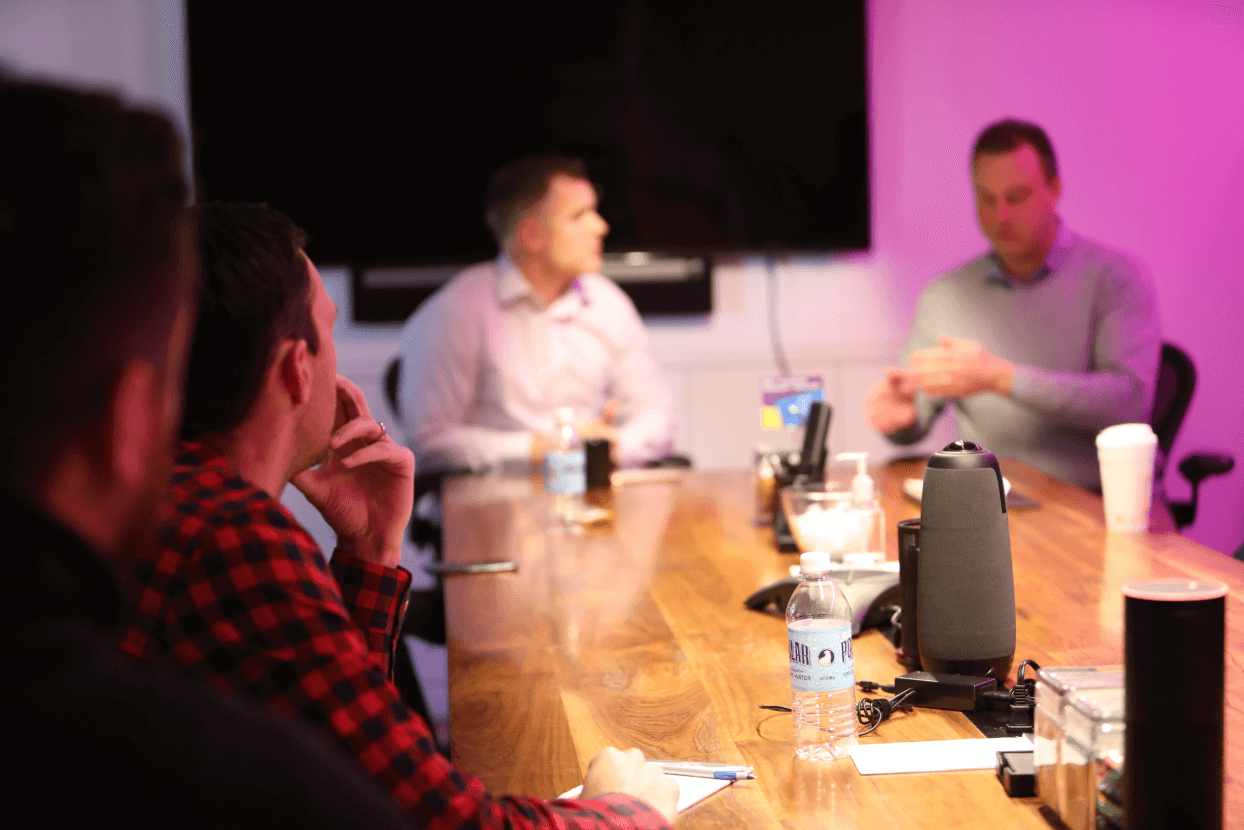 SaaS Academy attendees listen during a session