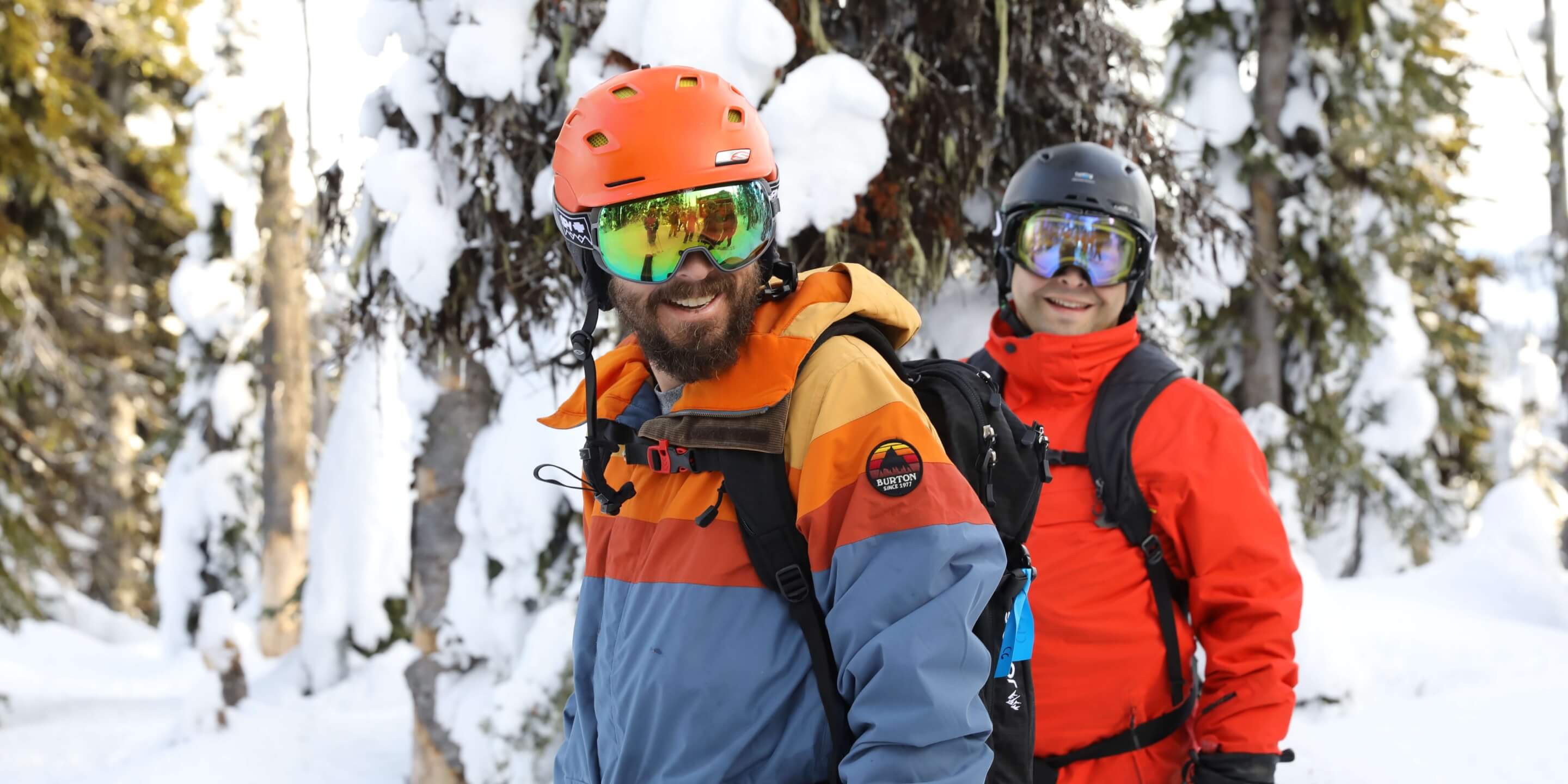Two SaaS Academy ski retreat participants in ski and snowboard gear