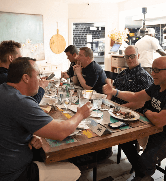 A group of program attendees eating together